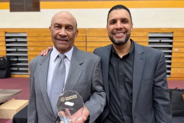 Michael Kennedy, Sr. holding his award next to his son, KAI CEO Michael Kennedy, Jr. | KAI Founder Michael Kennedy, Sr. Awarded with Lifetime Achievement Award During Construction Inclusion Week